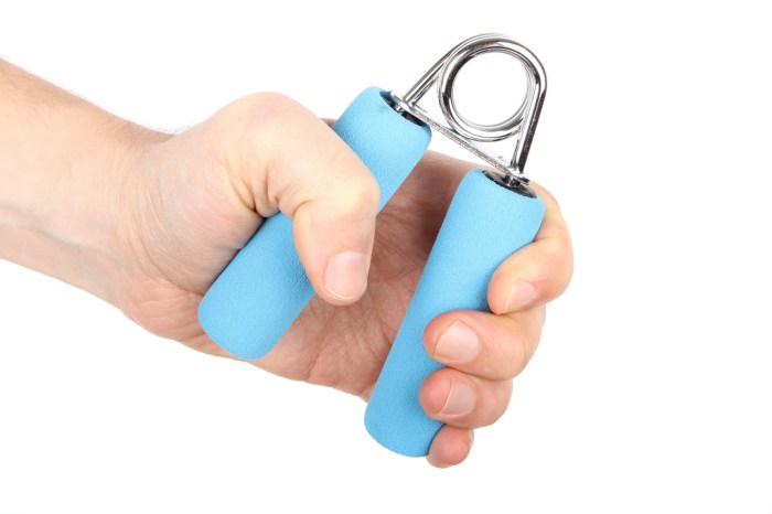 A hand exerciser utilizes a coiled spring